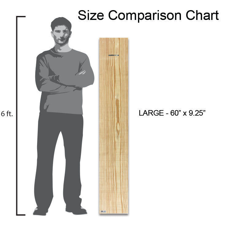 a man standing next to a tall wooden board